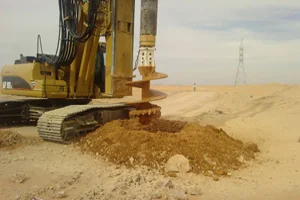 Auger drilling on a desert site